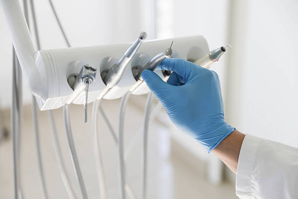 Professional Tooth Extraction technician working in Au Sable, MI